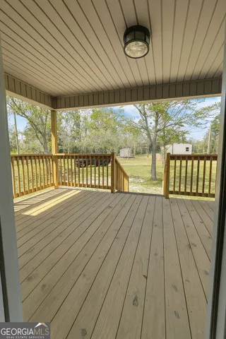 a view of balcony with wooden floor
