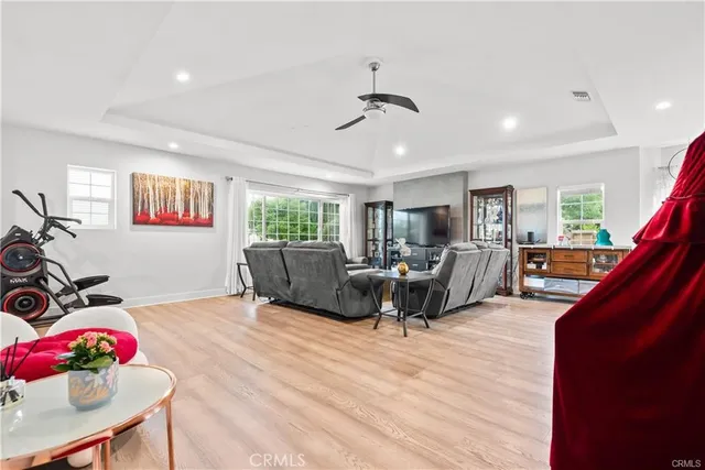 a living room with furniture window and wooden floor