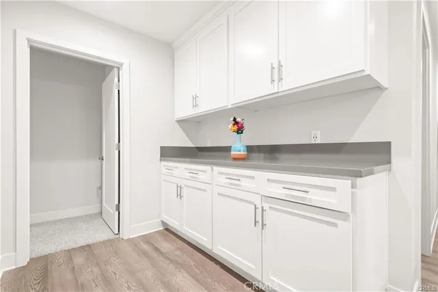 a bedroom with a large bed and a couch