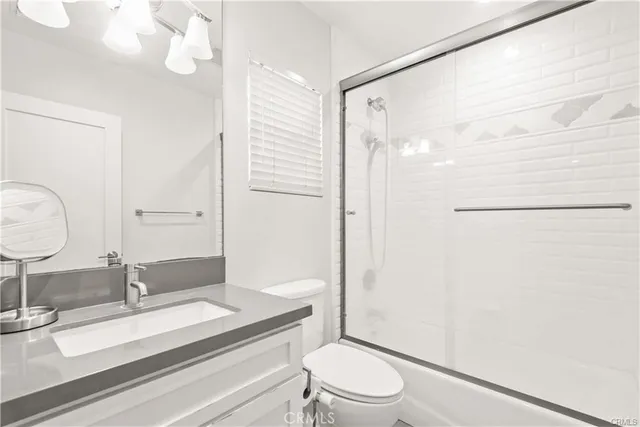 a bedroom with a bed and a cabinets