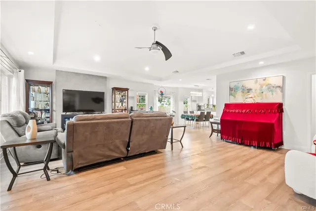 a living room with furniture gym equipment and a flat screen tv