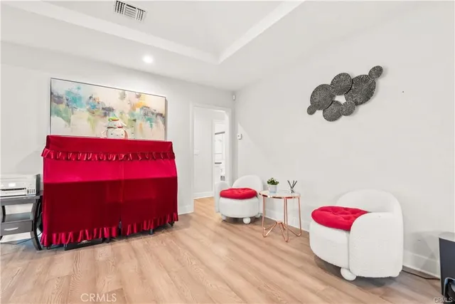 a bedroom with a bed and a couch