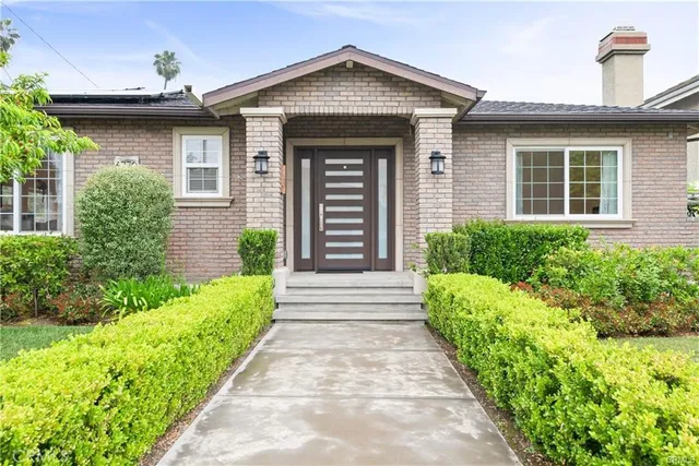 an aerial view of residential house with yard