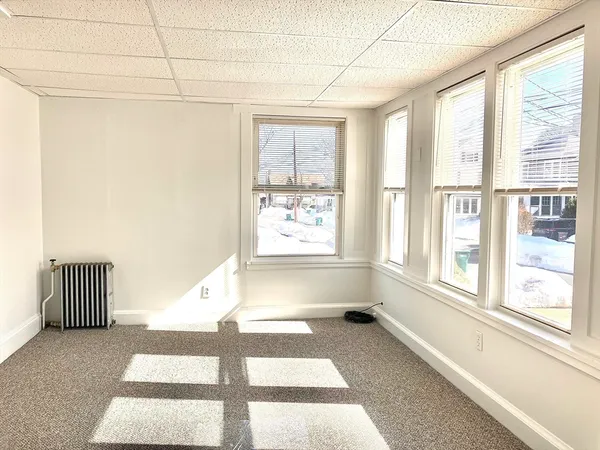 a view of a room with a large window