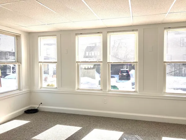 a view of a room with a large window