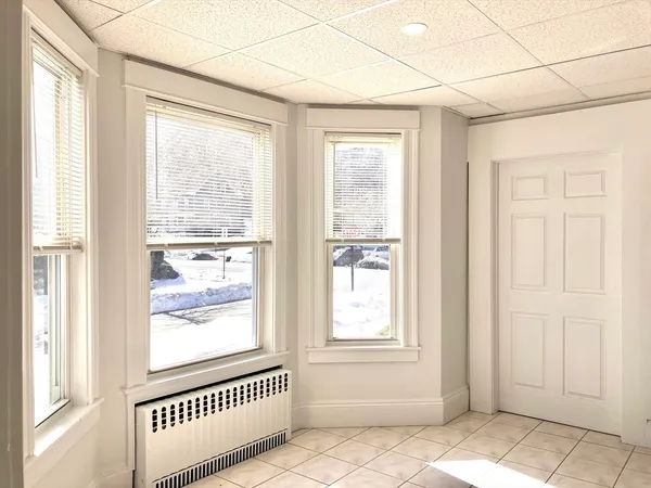 a kitchen with a stove a sink and a refrigerator