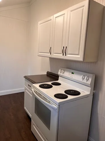 a kitchen with a stove and a microwave
