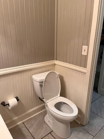a bathroom with a toilet and a sink