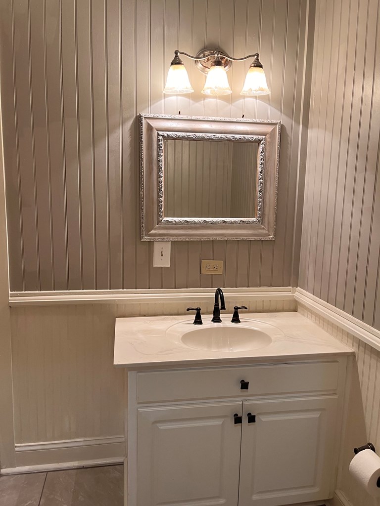 1212 18th Street, Unit A Columbus, GA 31901 - Photo 4 of 19 a sink with a mirror