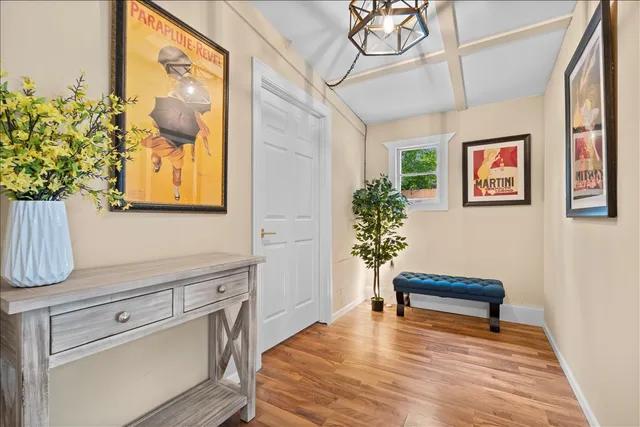 a view of room with cabinets and wooden floor
