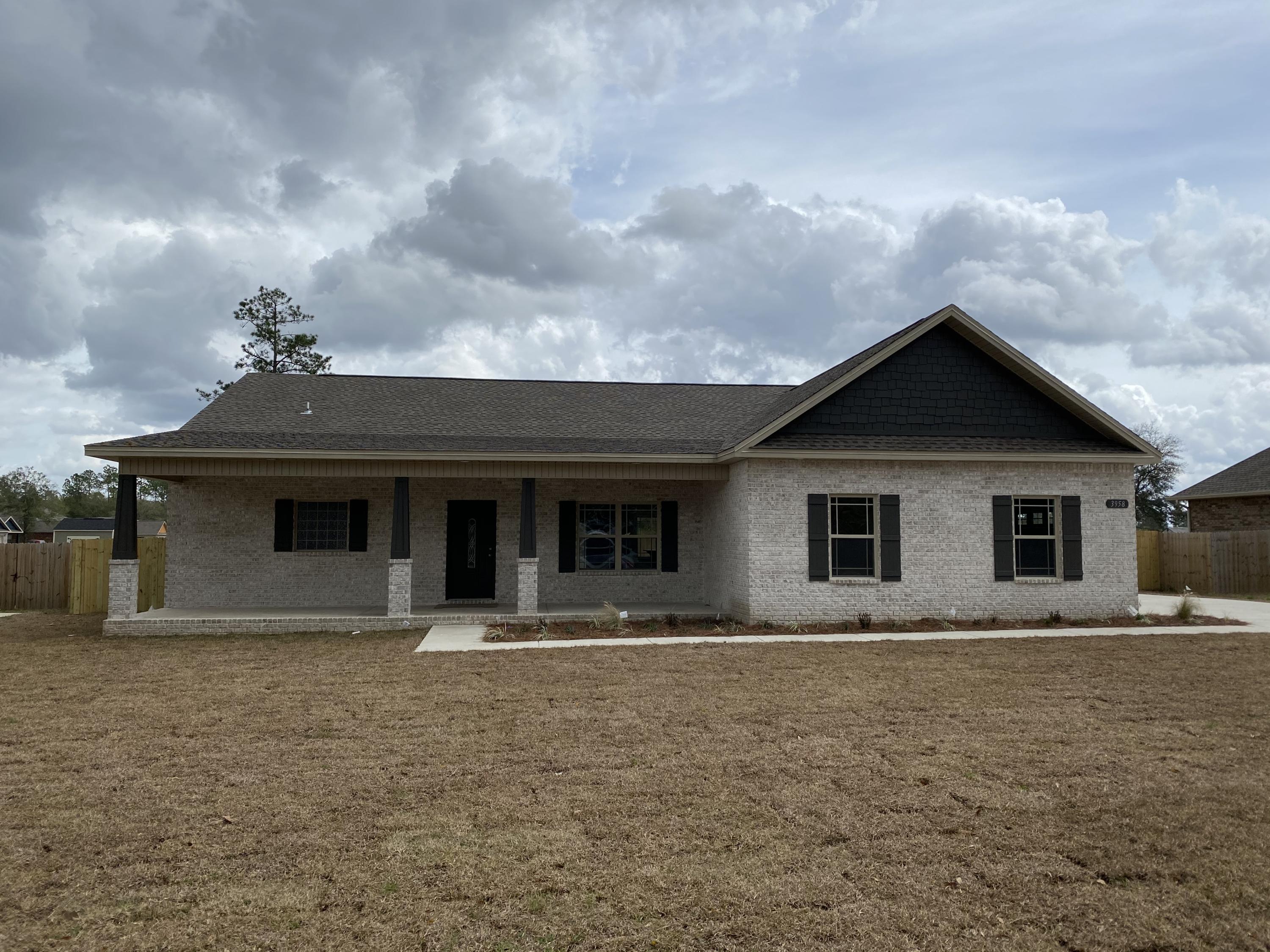 3958 Painter Branch Road Crestview, FL 32539 - Photo 1 of 15 a front view of house with yard