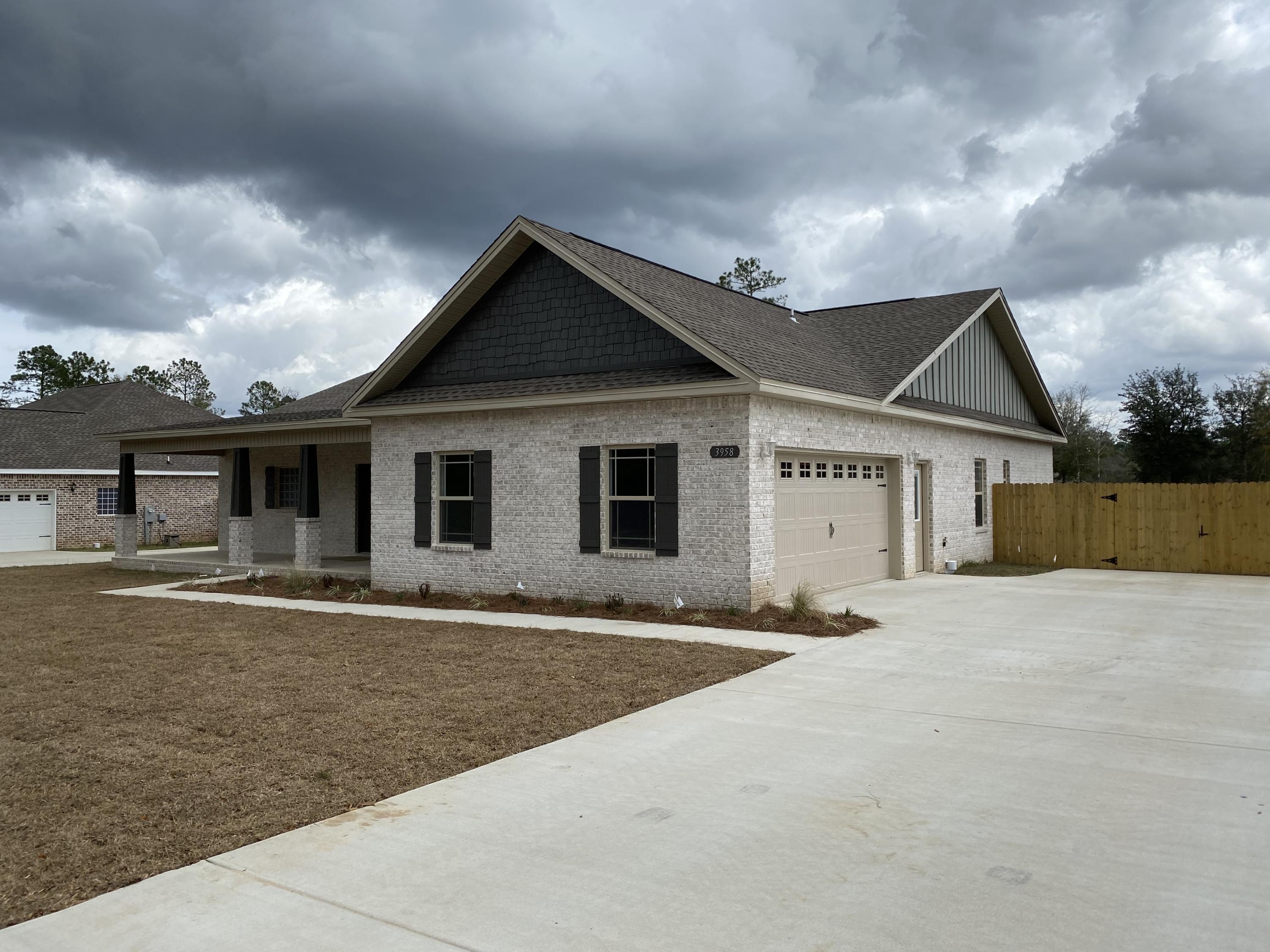 3958 Painter Branch Road Crestview, FL 32539 - Photo 2 of 15 a front view of a house with a yard