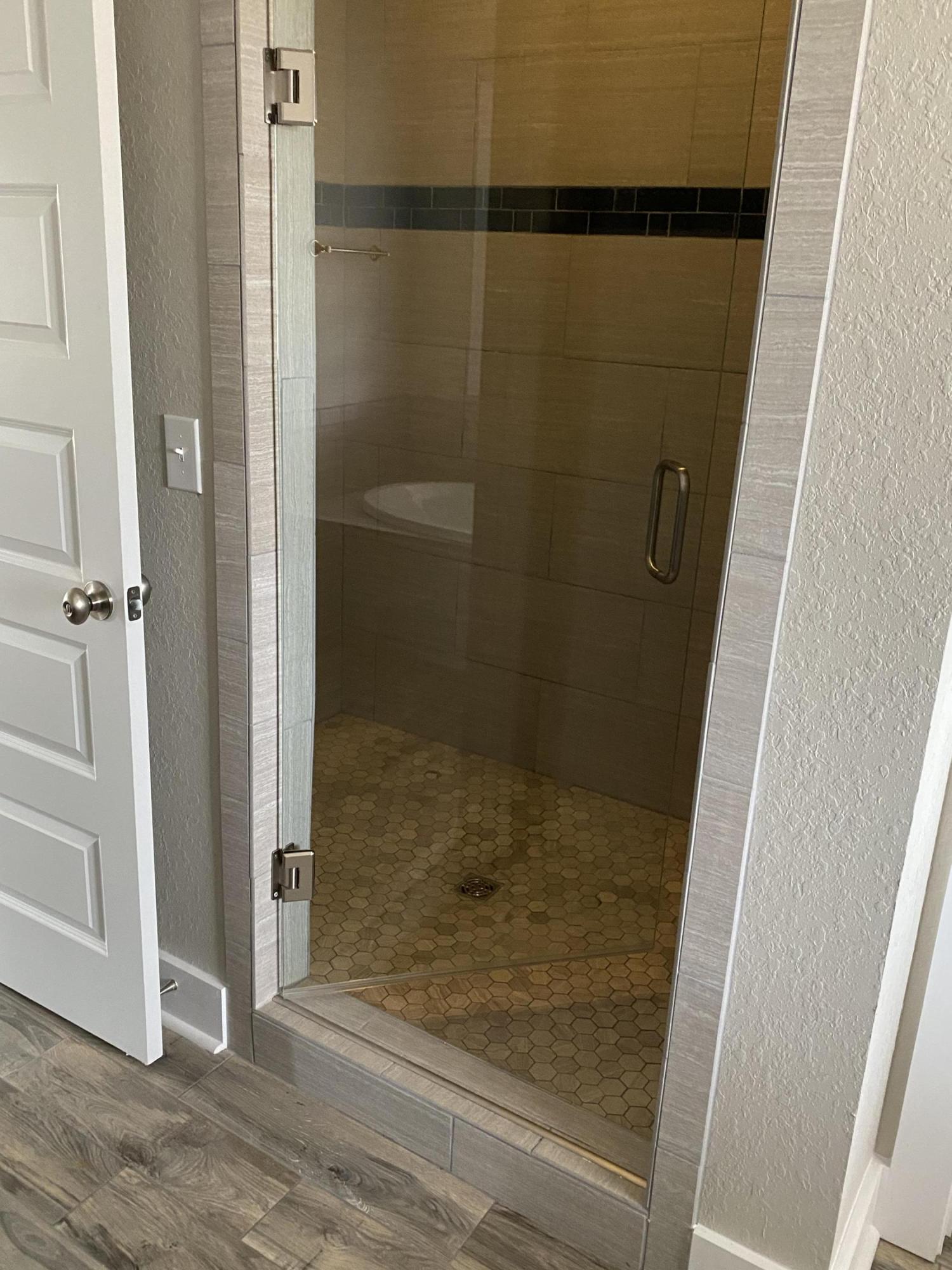 3958 Painter Branch Road Crestview, FL 32539 - Photo 13 of 15 a bathroom with a glass door shower