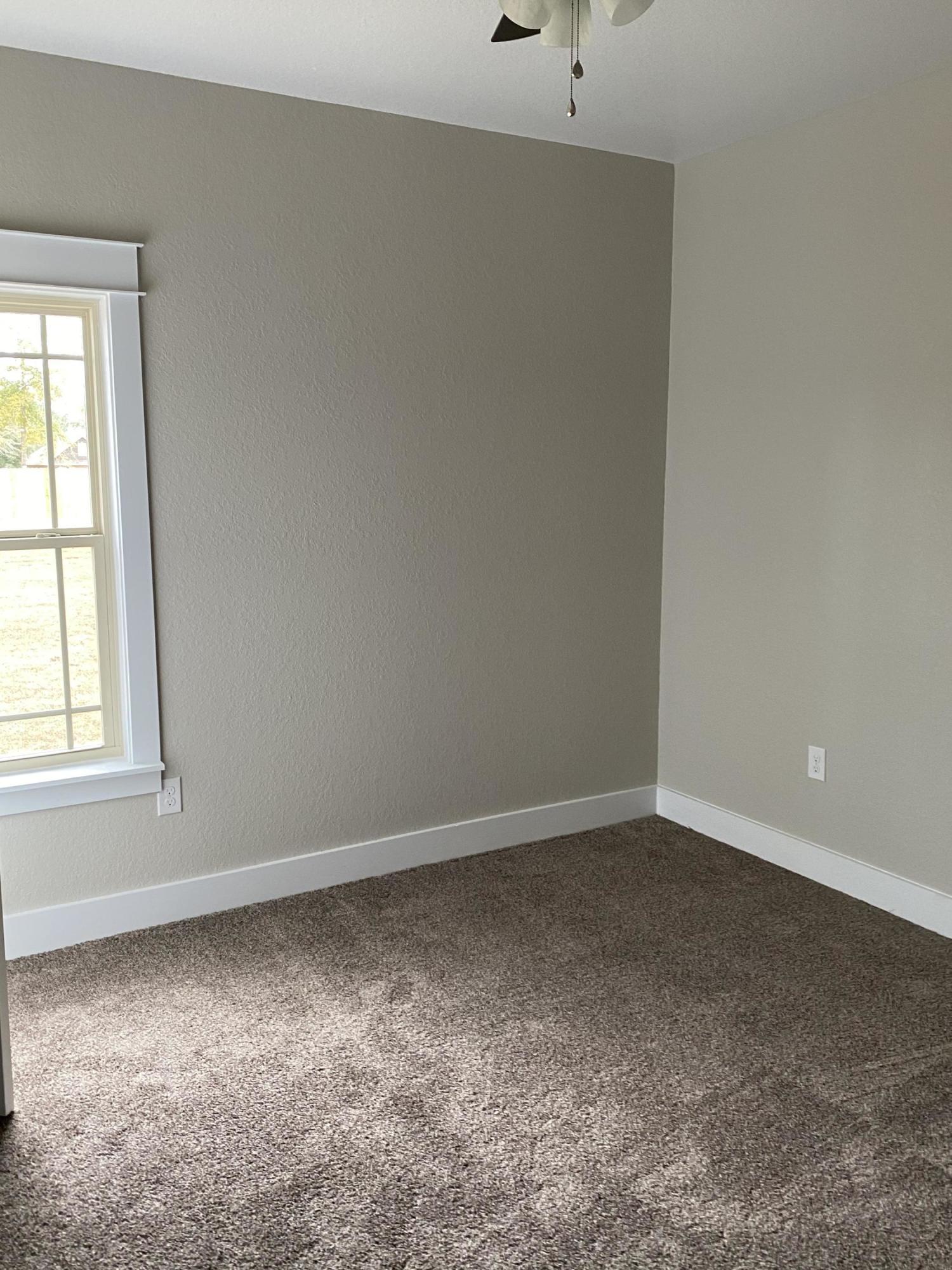 3958 Painter Branch Road Crestview, FL 32539 - Photo 14 of 15 an empty room with a window