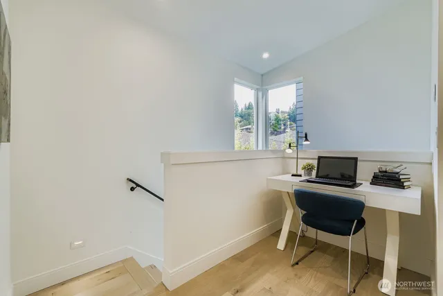 a workspace with furniture and window