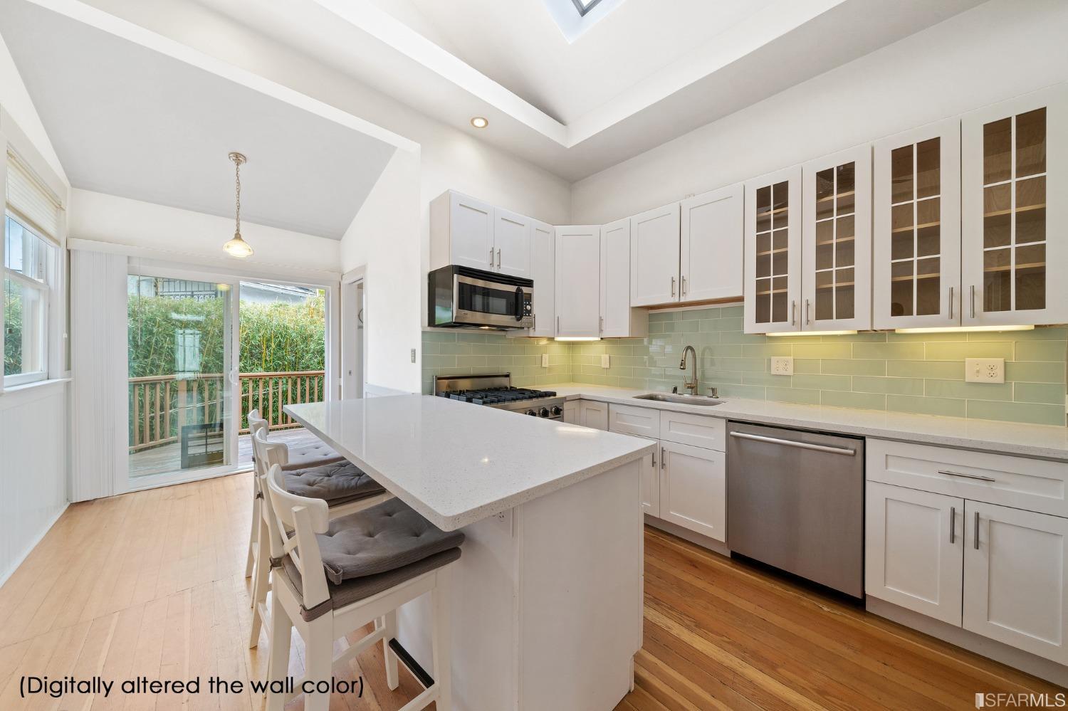 3754 Cesar Chavez San Francisco, CA 94110 - Photo 1 of 16 a kitchen with kitchen island a stove a sink a dining table and chairs