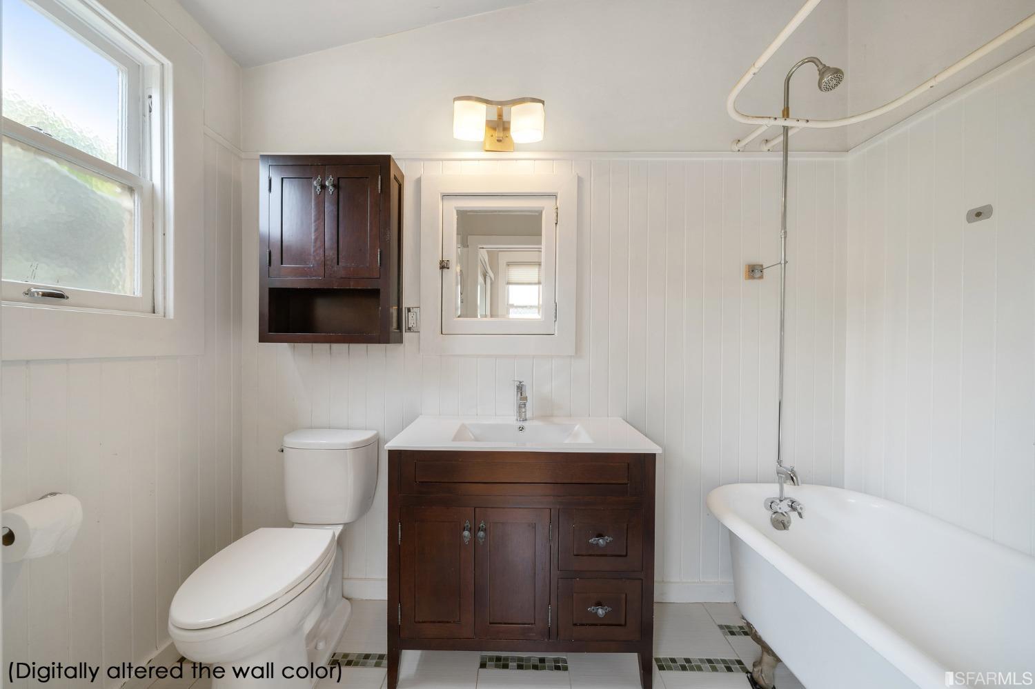 3754 Cesar Chavez San Francisco, CA 94110 - Photo 12 of 16 a bathroom with a toilet sink and mirror
