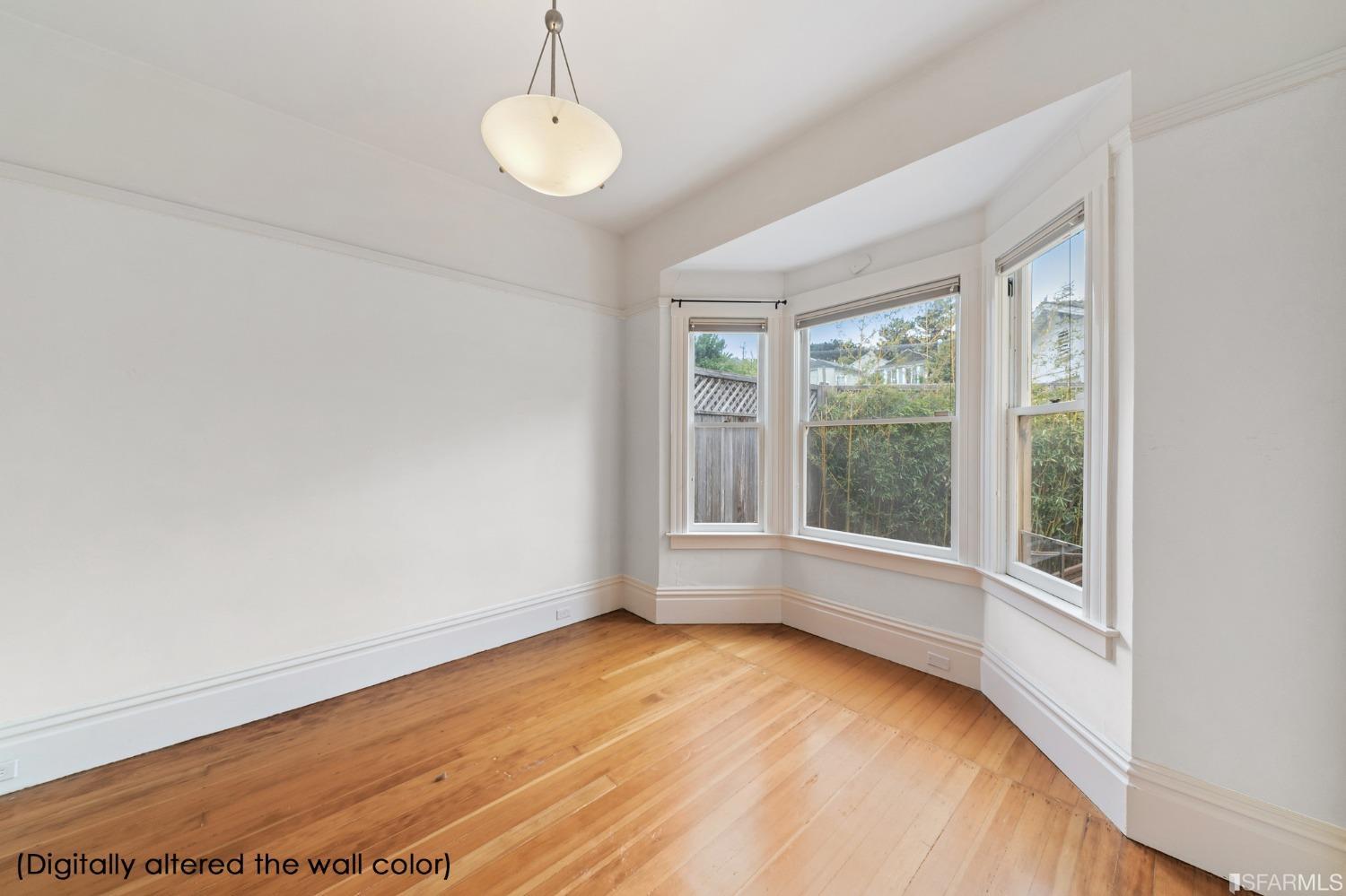 3754 Cesar Chavez San Francisco, CA 94110 - Photo 8 of 16 an empty room with wooden floor and windows