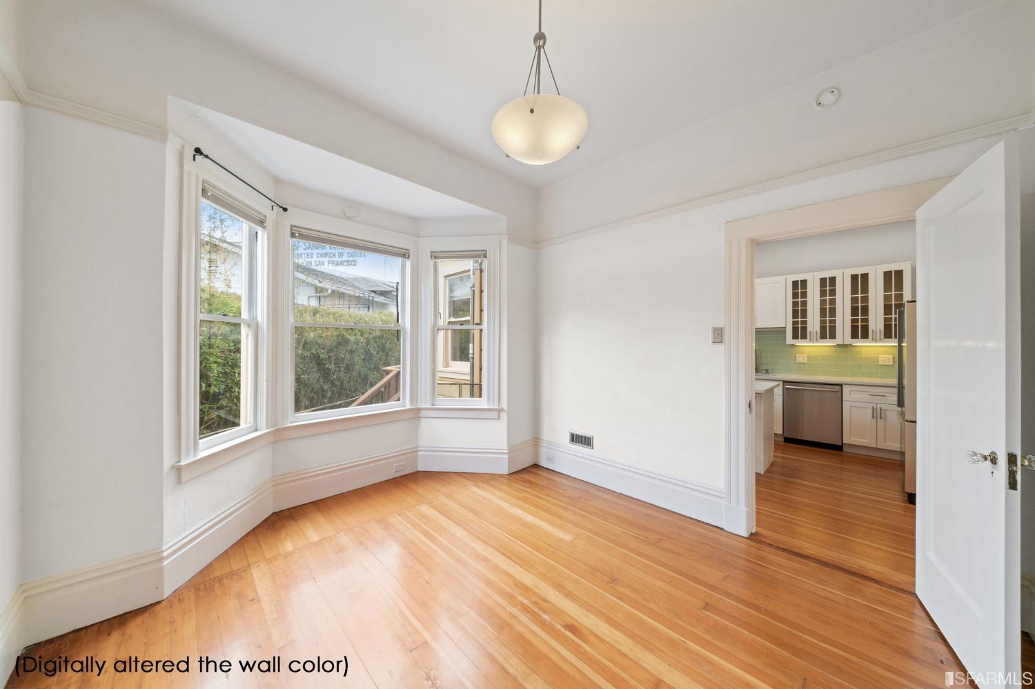 3754 Cesar Chavez San Francisco, CA 94110 - Photo 9 of 16 a view of an empty room with a window and wooden floor