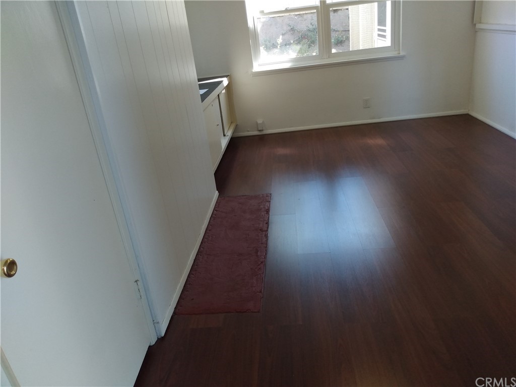 357 Parkman Street Altadena, CA 91001 - Photo 41 of 73 an empty room with wooden floor and windows