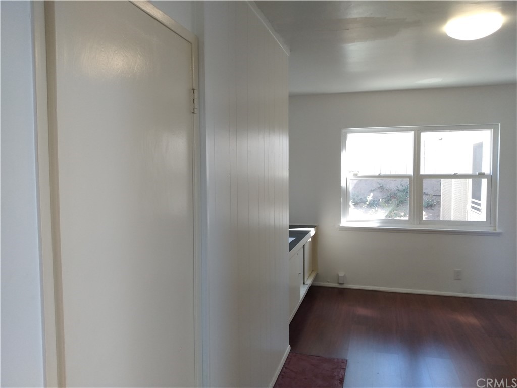 357 Parkman Street Altadena, CA 91001 - Photo 42 of 73 an empty room with wooden floor and windows