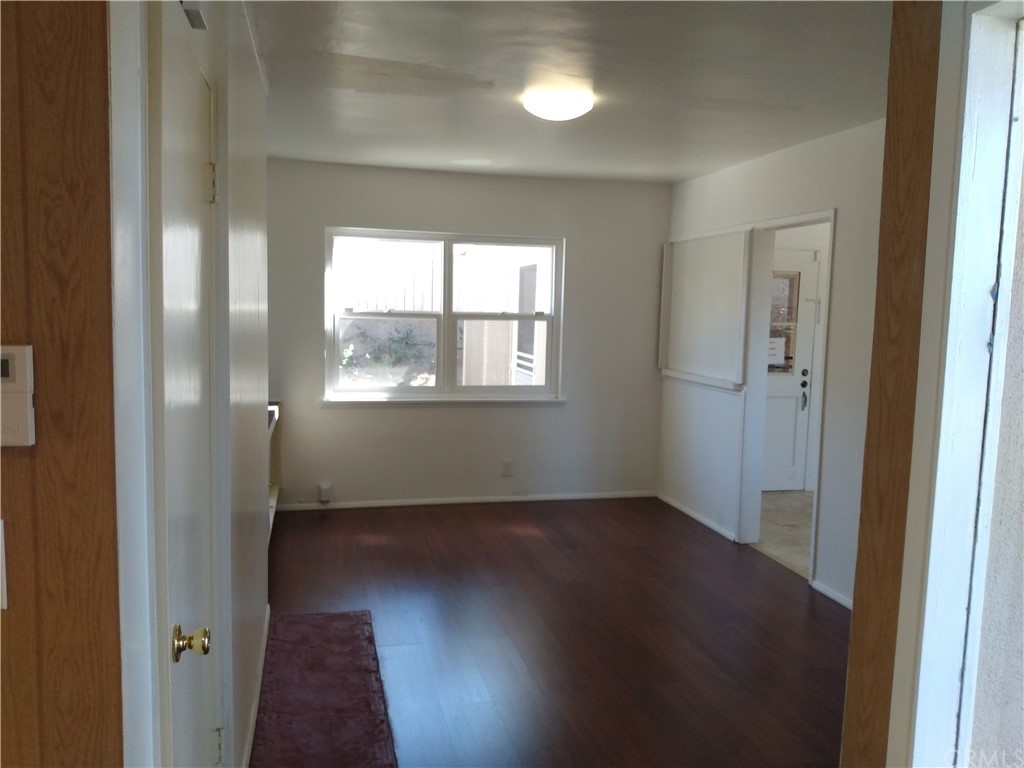 357 Parkman Street Altadena, CA 91001 - Photo 43 of 73 an empty room with wooden floor and windows