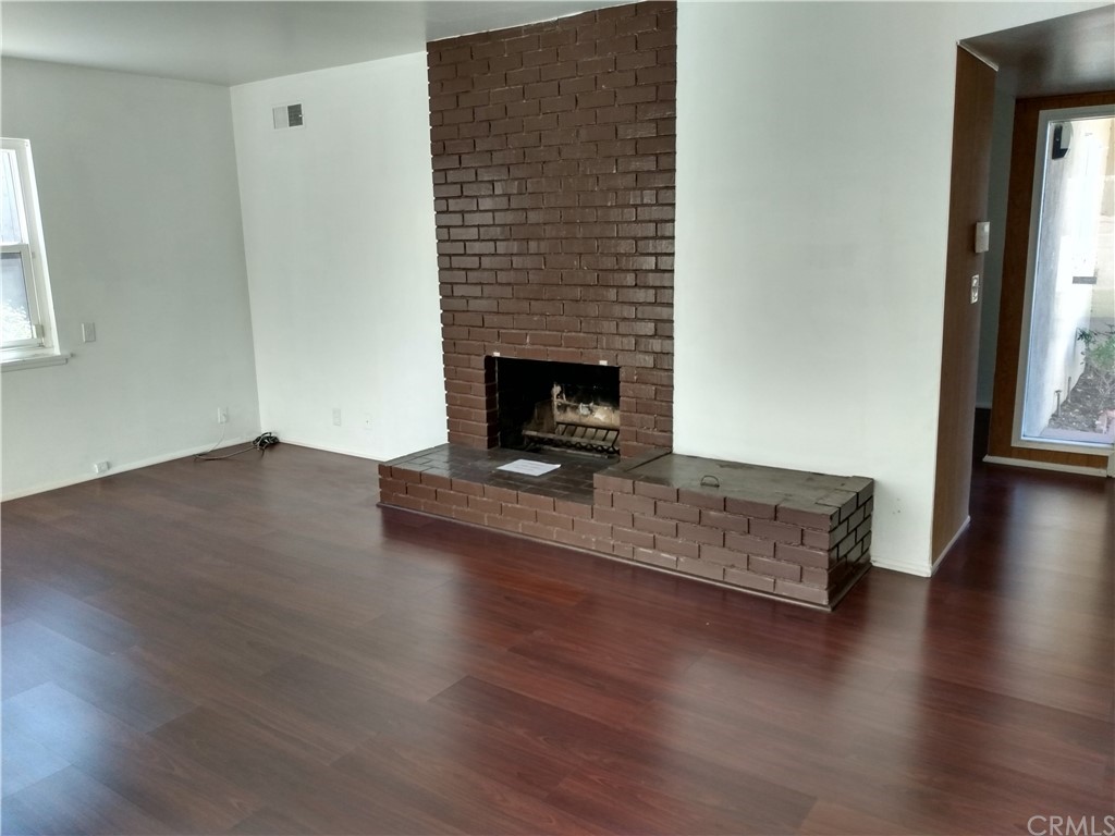 357 Parkman Street Altadena, CA 91001 - Photo 50 of 73 a living room with hard wood floors and a fireplace