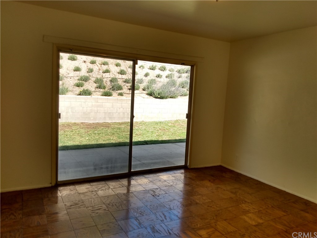 357 Parkman Street Altadena, CA 91001 - Photo 57 of 73 a view of an empty room with wooden floor and iron stairs