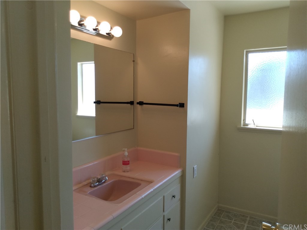 357 Parkman Street Altadena, CA 91001 - Photo 62 of 73 a bathroom with a sink a vanity and a mirror