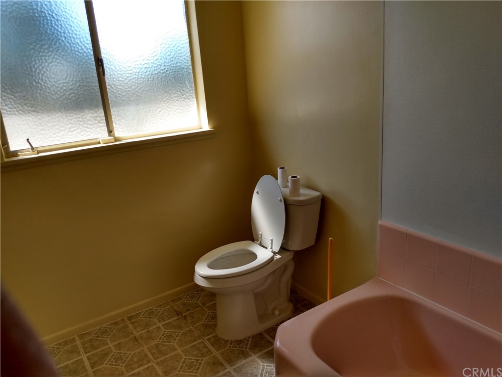 357 Parkman Street Altadena, CA 91001 - Photo 63 of 73 a bathroom with a toilet and a mirror
