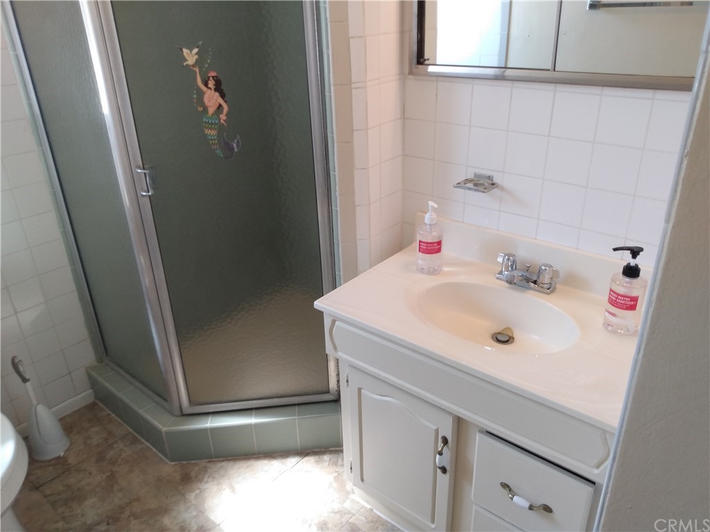 357 Parkman Street Altadena, CA 91001 - Photo 65 of 73 a bathroom with a sink and a mirror
