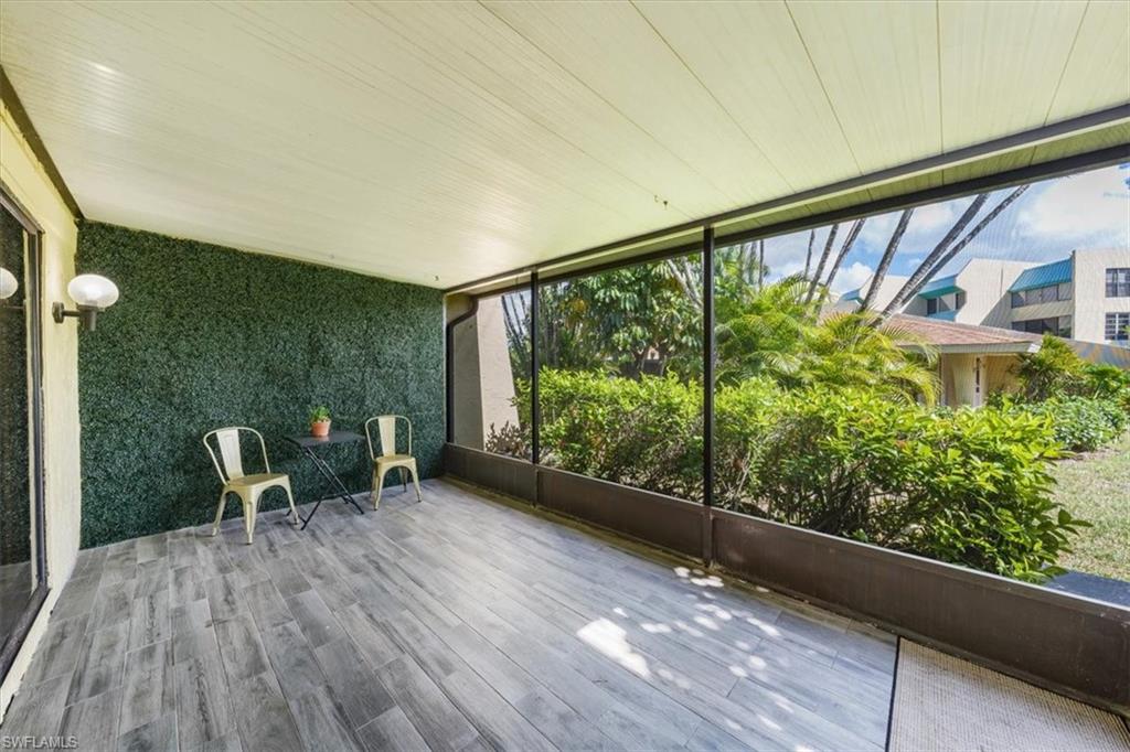 925 Palm View Drive, Unit E118 Naples, FL 34110 - Photo 15 of 26 a view of deck with patio