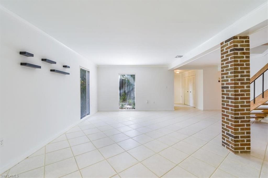 925 Palm View Drive, Unit E118 Naples, FL 34110 - Photo 6 of 26 a view of an empty room and window