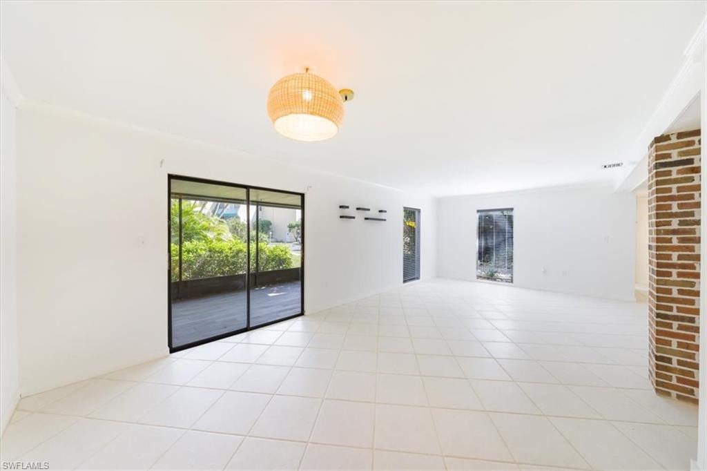 925 Palm View Drive, Unit E118 Naples, FL 34110 - Photo 8 of 26 a view of an empty room with a window
