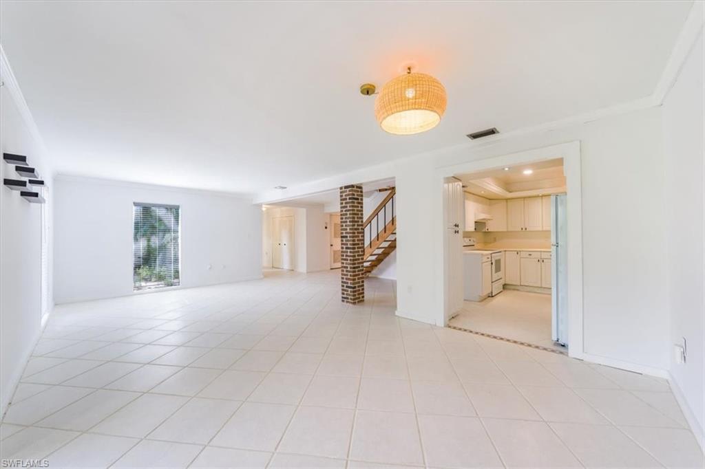 925 Palm View Drive, Unit E118 Naples, FL 34110 - Photo 10 of 26 an empty room with windows and closet