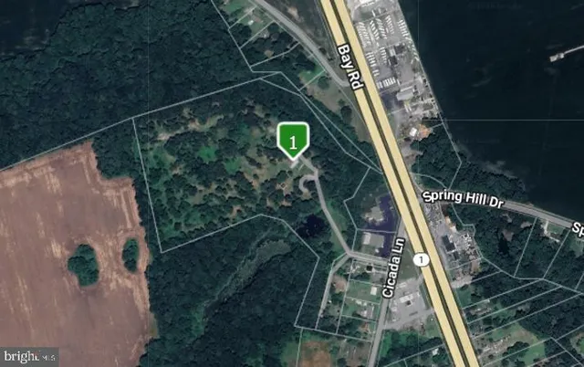 an aerial view of houses with yard