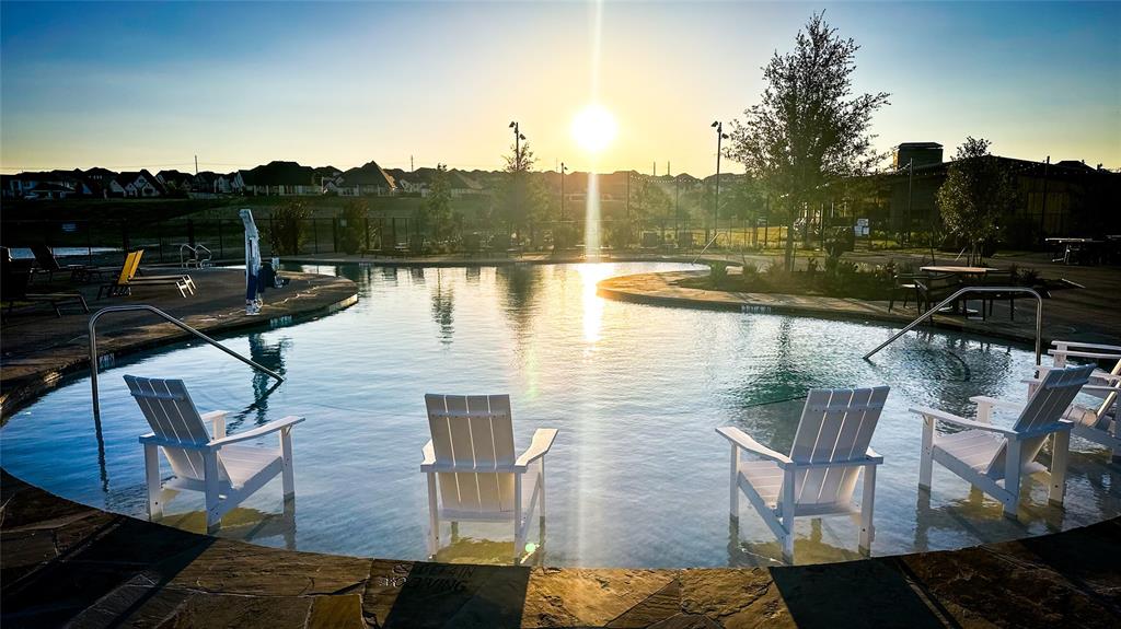 172 Summer Rain Way Newark, TX 76071 - Photo 4 of 11 a view of a lake with a terrace