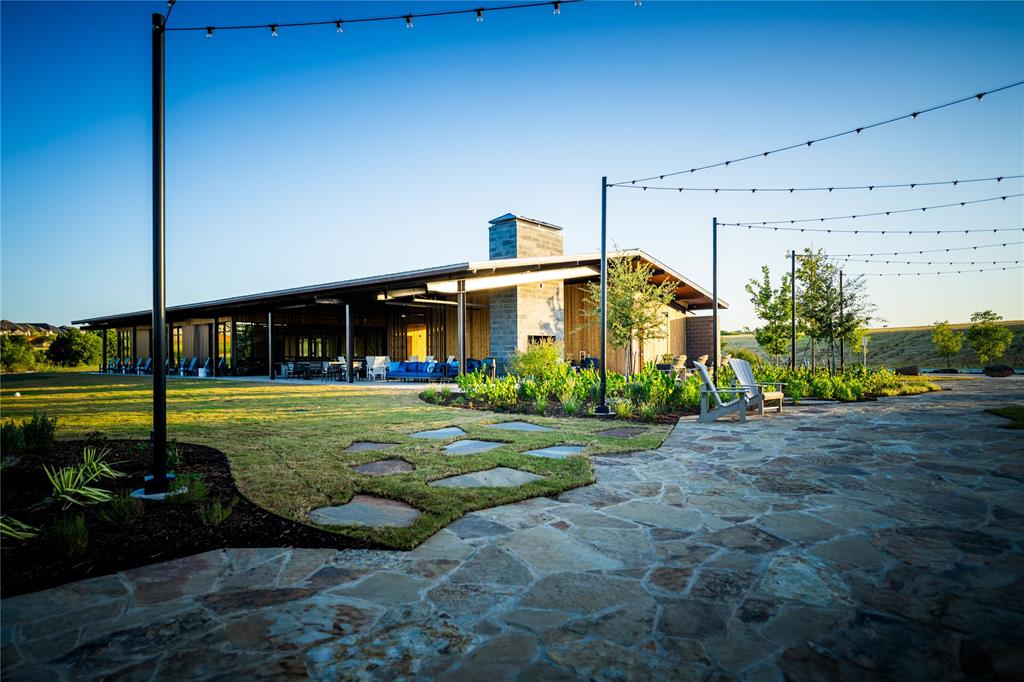 172 Summer Rain Way Newark, TX 76071 - Photo 5 of 11 a front view of a house with garden