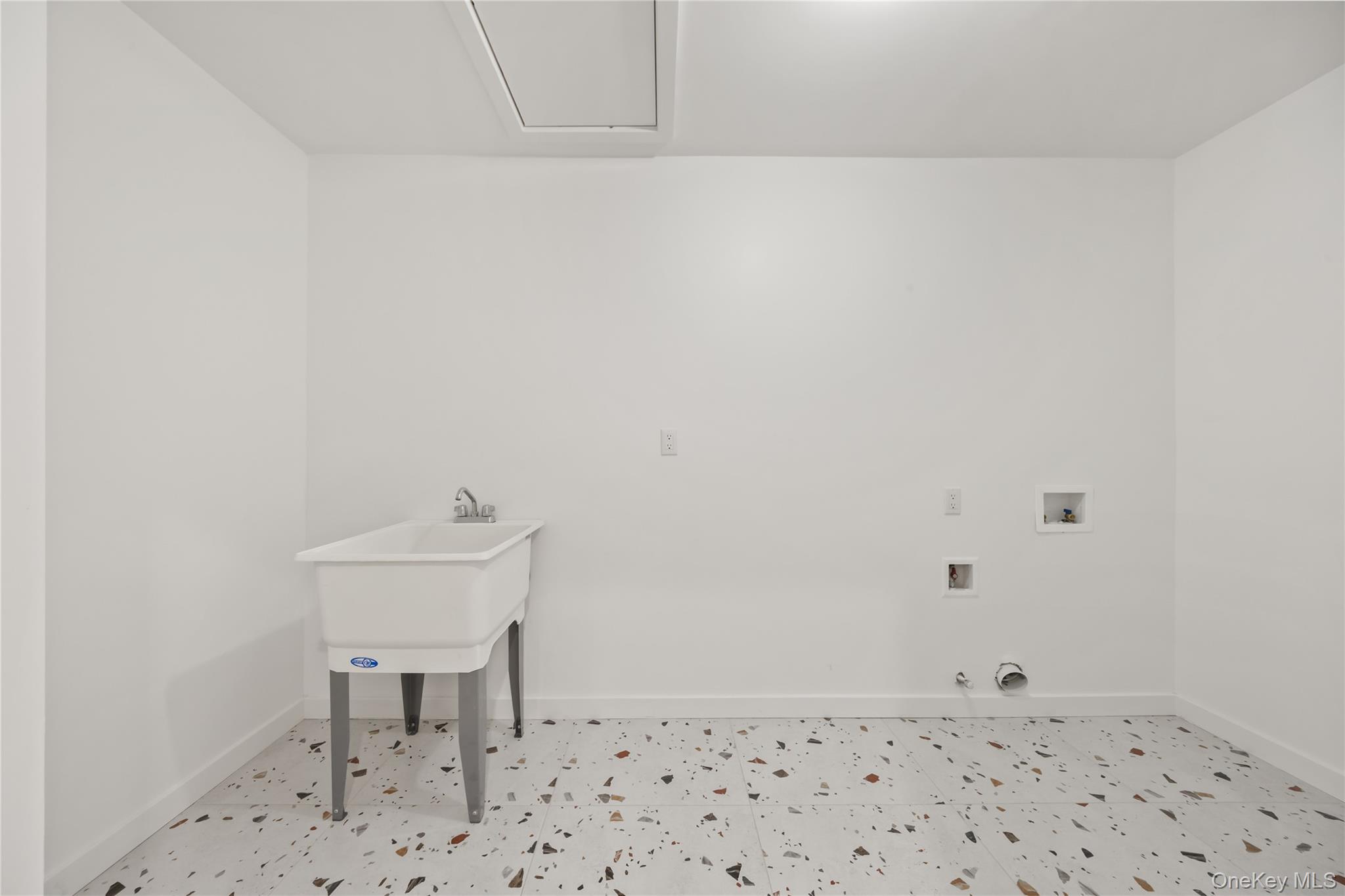 23 Singer Avenue, Unit 211 Spring Valley, NY 10977 - Photo 32 of 45 a bathroom with a sink a chair and a toilet