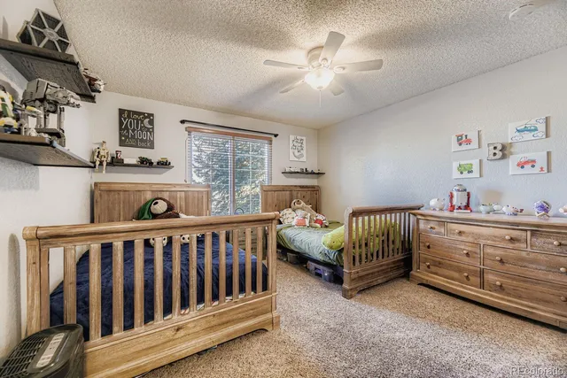 a bedroom with furniture and a chandelier