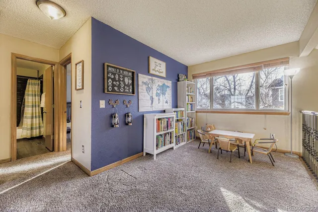 a view of a livingroom with furniture and window