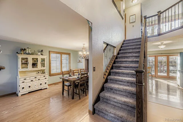 a view of a livingroom with furniture and entryway