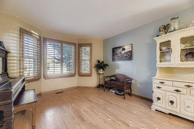 a workspace with furniture and a window