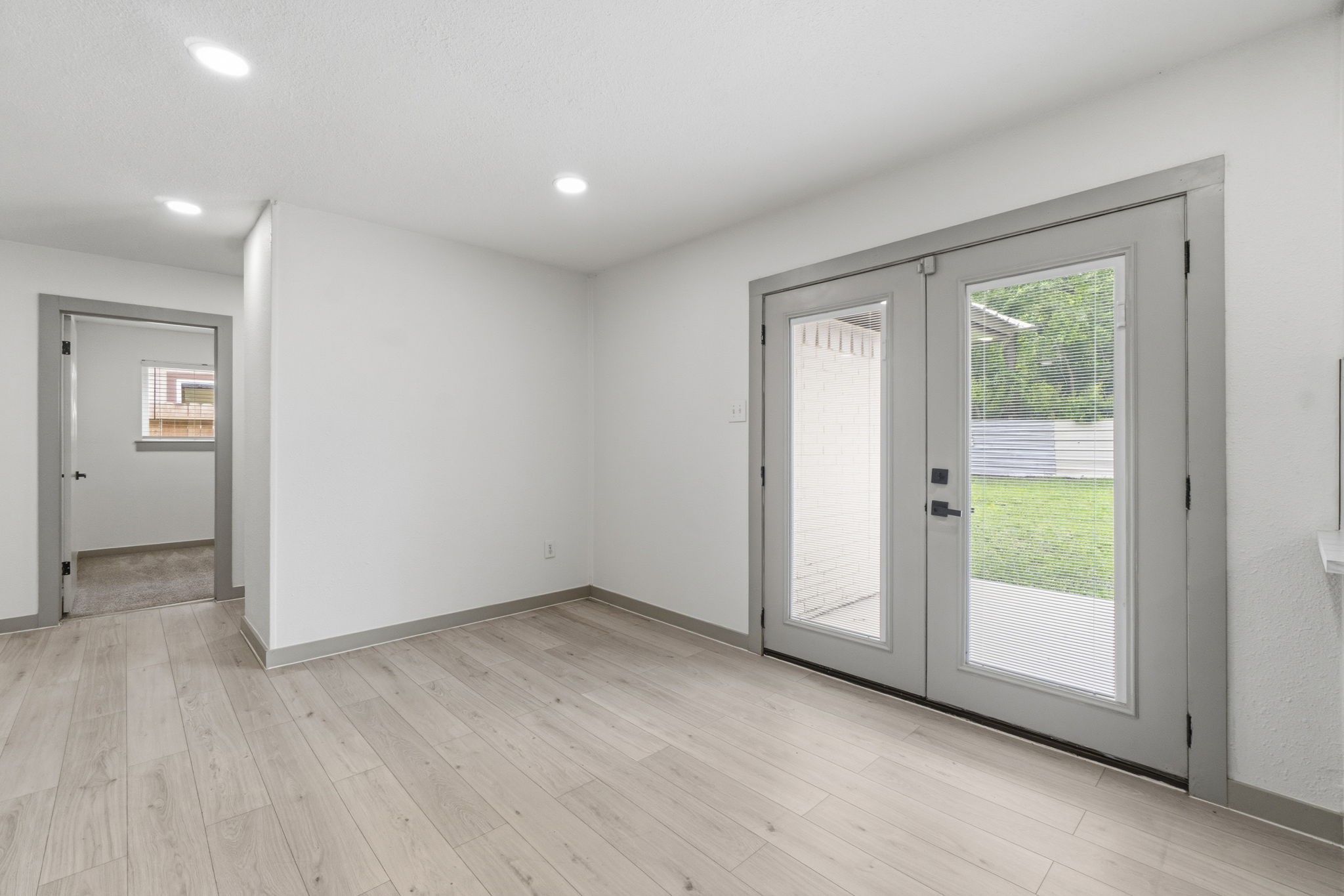 14850 Coaltown Road Willis, TX 77378 - Photo 11 of 41 Dining area with double glass doors providing natural light and easy access to the backyard and outdoor entertaining space.