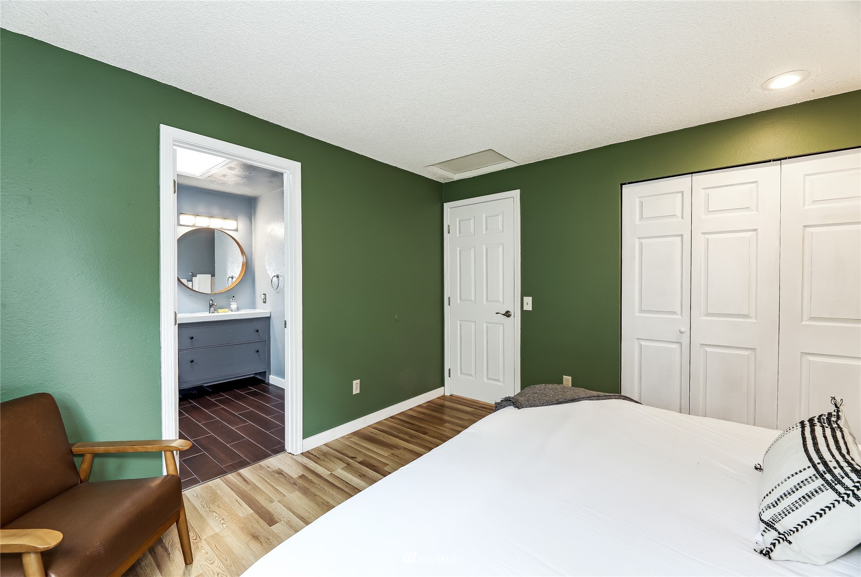 17818 Brook Boulevard Bothell, WA 98012 - Photo 12 of 27 a bedroom with a bed and a couch