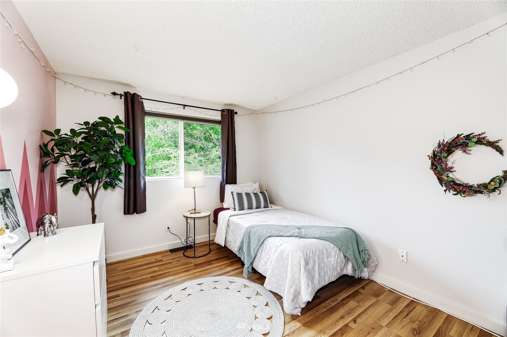 17818 Brook Boulevard Bothell, WA 98012 - Photo 14 of 27 a bedroom with a bed and a potted plant