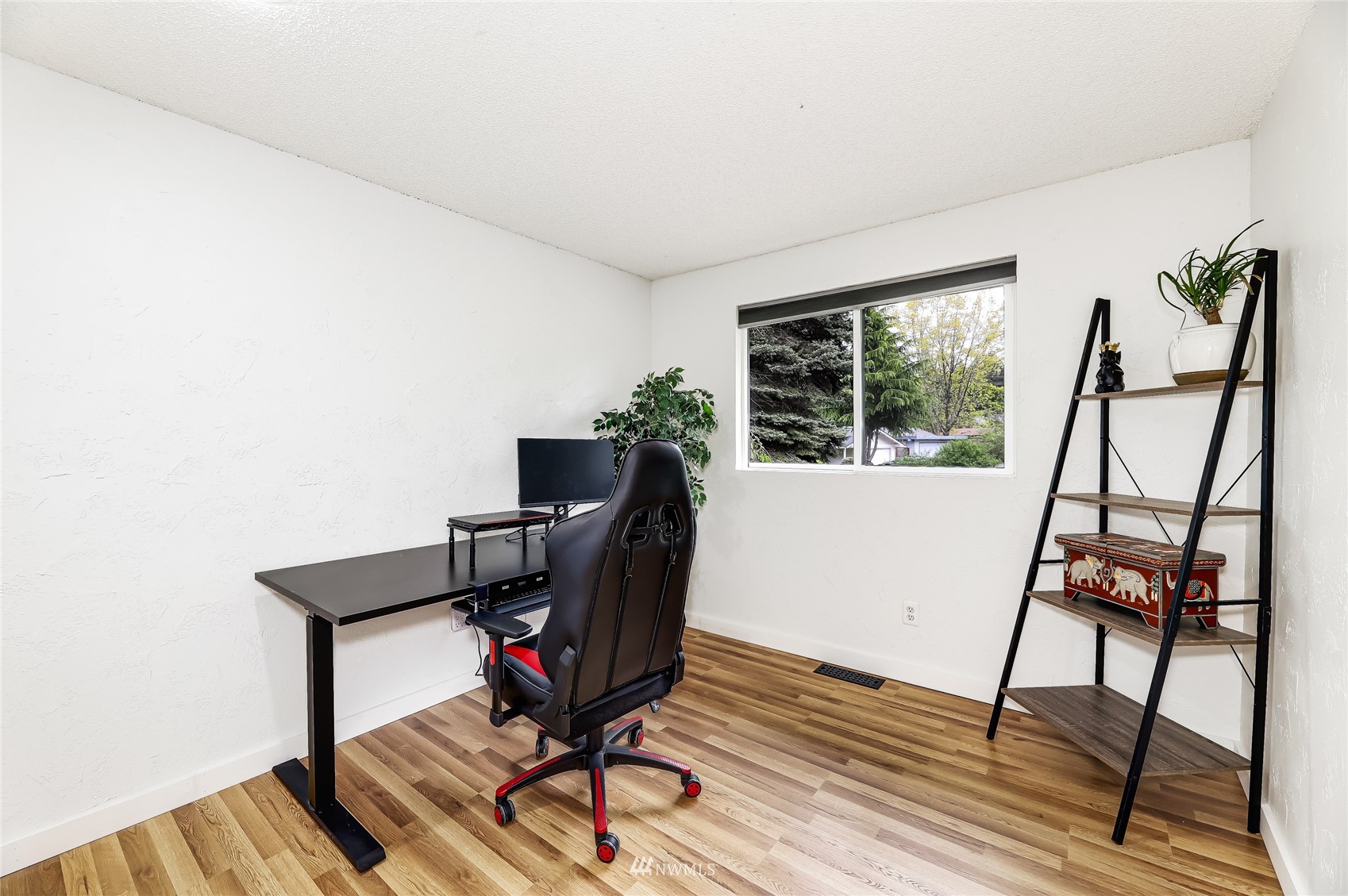 17818 Brook Boulevard Bothell, WA 98012 - Photo 15 of 27 a view of a workspace with furniture and a window