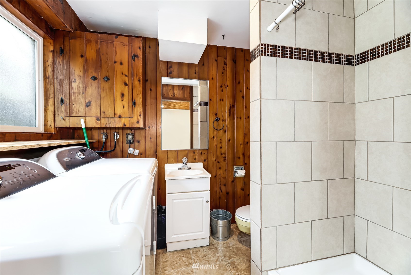17818 Brook Boulevard Bothell, WA 98012 - Photo 17 of 27 a bathroom with a sink toilet and shower