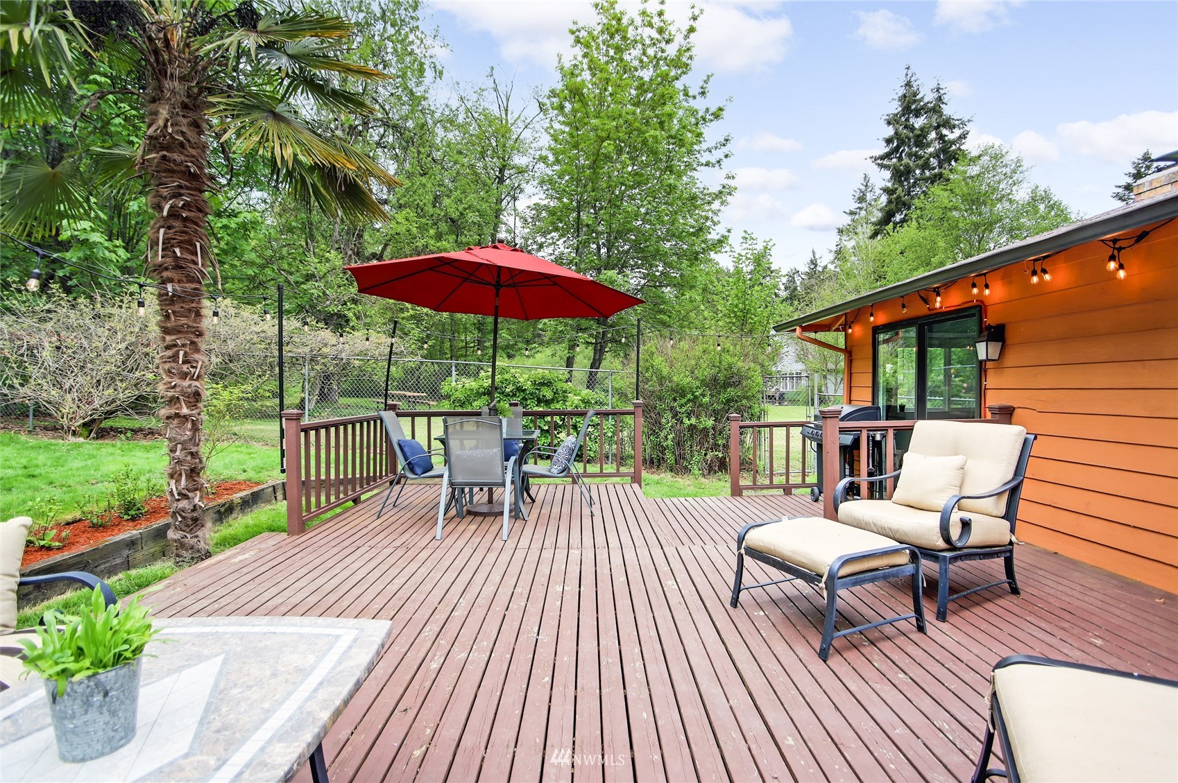 17818 Brook Boulevard Bothell, WA 98012 - Photo 19 of 27 a view of balcony with outdoor seating and wooden floor