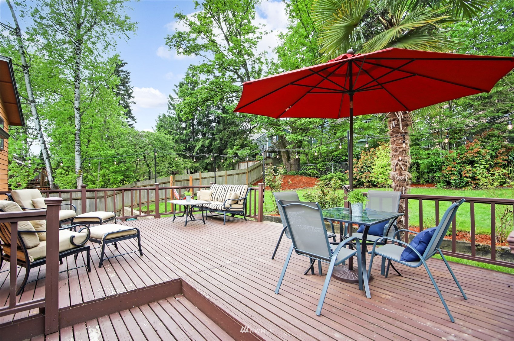 17818 Brook Boulevard Bothell, WA 98012 - Photo 20 of 27 a view of a chairs and table on the wooden deck